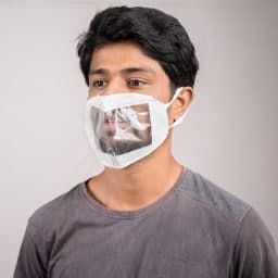 young man with transparent Medical face mask, to help hearing impermeant or deaf people to understand lipreading during coronavirus or covid-19 outbreak