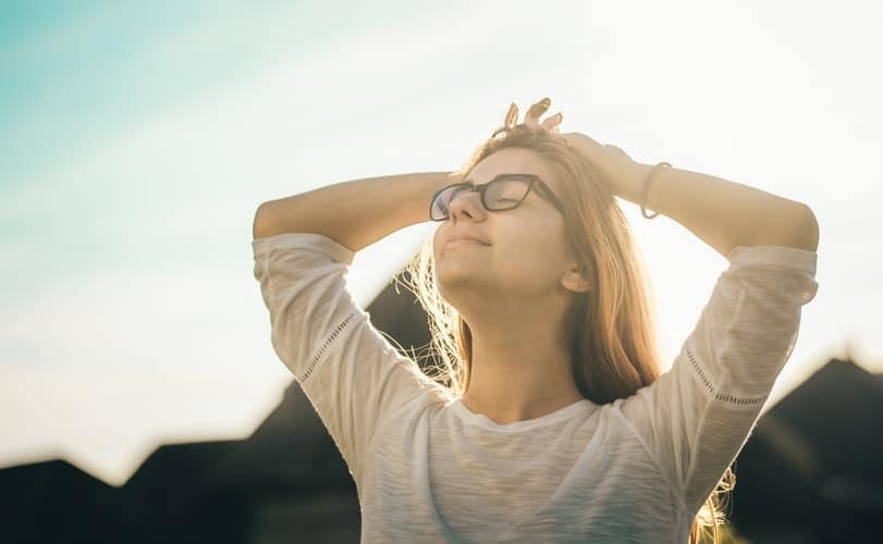 Woman managing stress outdoors