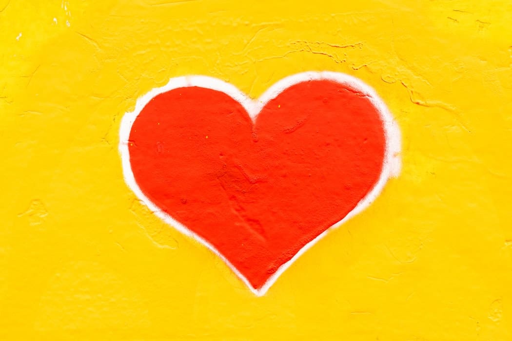 Painting of a heart on a wall.