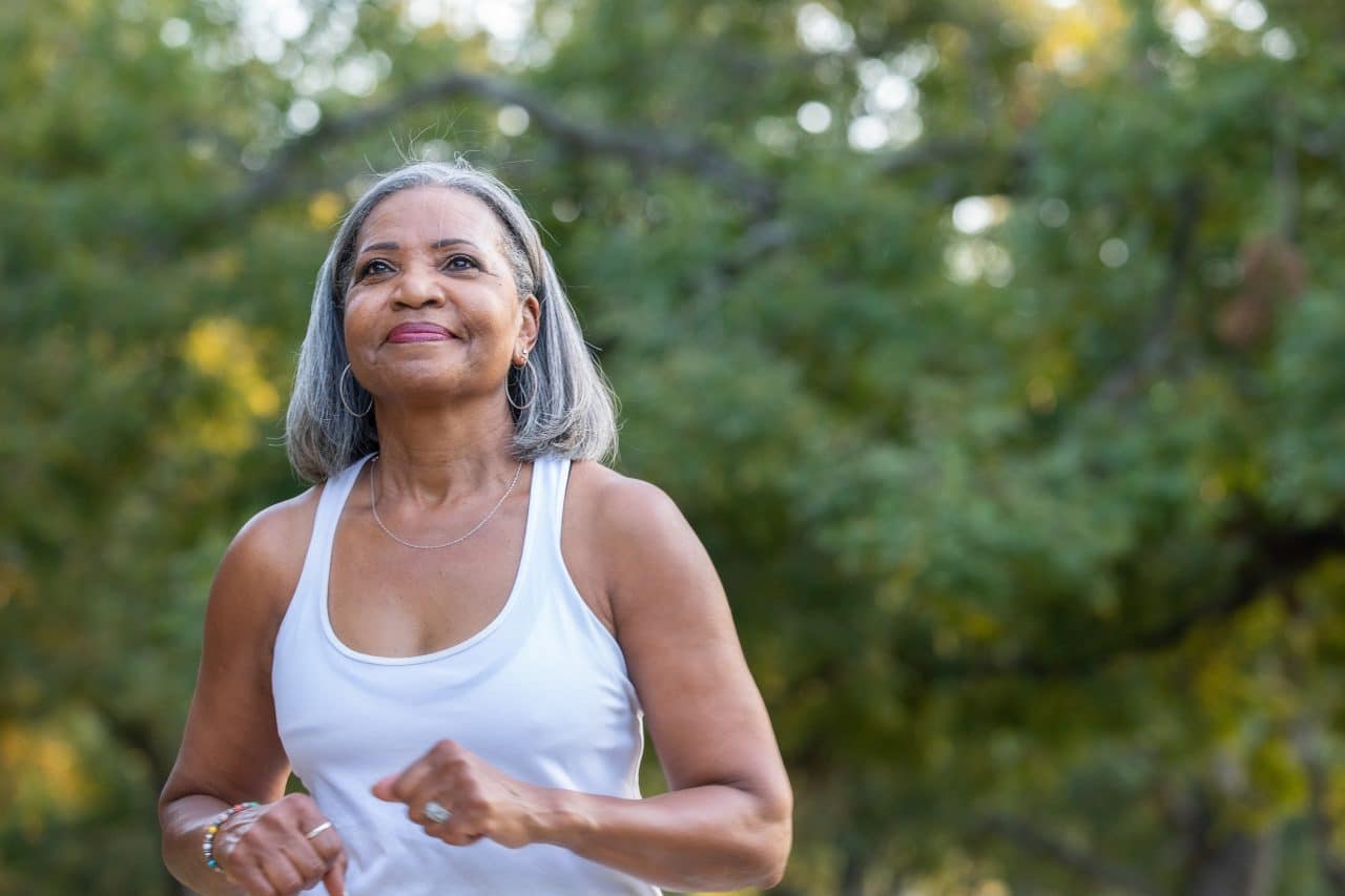 Woman going for a light jog in the park.